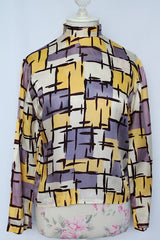 Women's vintage 1960's Fritzi of California label long sleeve mock neck blouse with zipper in the back.