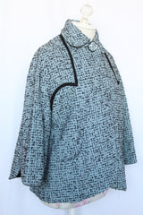 Women's vintage 1940's Bedell, An Original by Solmar - The Finest Name in Fashion label short sleeve wool cropped jacket with one button closure. Has small rounded collar, big clear button, blue colored.