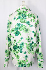 Women's or men's vintage 1970's Triumph of California label long sleeve button up shirt with dagger collar. White polyester with all over green floral print.