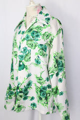 Women's or men's vintage 1970's Triumph of California label long sleeve button up shirt with dagger collar. White polyester with all over green floral print.