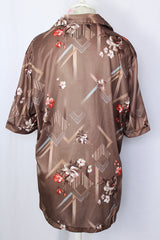 Women's or men's vintage 1970's Triumph of California label short sleeve button up shirt with pointy collar in polyester material.