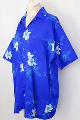 Women's or men's vintage 1970's Davina Honolulu label short sleeve button up shirt with pointy collar in all over blue Hawaiian floral print in lightweight polyester.