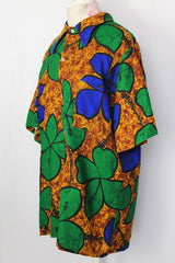 Women's or men's vintage 1970's Towncraft for JCPenney label short sleeve button up Hawaiian print shirt in brown, green, and blue Hawaiian print.