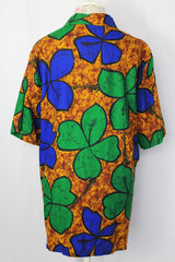 Women's or men's vintage 1970's Towncraft for JCPenney label short sleeve button up Hawaiian print shirt in brown, green, and blue Hawaiian print.