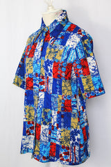 Women's vintage 1970's Hilton Head Islanders label short sleeve button up blouse with dagger collar in all over blue, white, and red floral print.