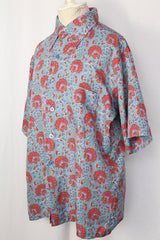 Women's or men's vintage 1970's JCPenney label short sleeve button up shirt with dagger collar in a lightweight polyester blue paisley print material.