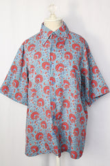 Women's or men's vintage 1970's JCPenney label short sleeve button up shirt with dagger collar in a lightweight polyester blue paisley print material.