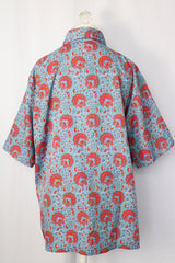 Women's or men's vintage 1970's JCPenney label short sleeve button up shirt with dagger collar in a lightweight polyester blue paisley print material.