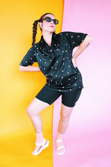 short sleeve black polyester half button shirt with collar with blue and pink square print