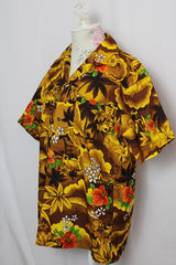 Women's or men's vintage 1970's short sleeve button up Hawaiian print shirt in yellow and brown colors.