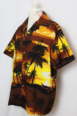 Men's or women's vintage 1970's Kai Nani Hawaii short sleeve button up shirt with double lapel in lightweight polyester in brown and yellow all over Hawaiian print.