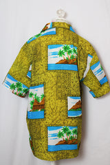 Women's or men's vintage 1970's short sleeve button up shirt in an all over green Hawaiian print.