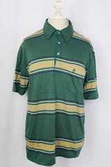 Women's or men's vintage 1980's Munsingwear, Made in USA label short sleeve green striped polo t-shirt with collar and half button closure. Polyester cotton blend.
