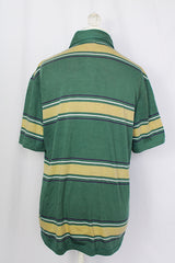 Women's or men's vintage 1980's Munsingwear, Made in USA label short sleeve green striped polo t-shirt with collar and half button closure. Polyester cotton blend.