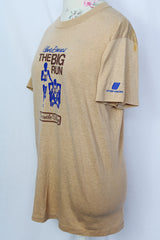 Women's or men's vintage 1970's Sport-T label short sleeve tan colored t-shirt with brown and blue graphic on the front.