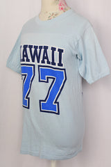 Women's or men's vintage 1970's Crazy Shirt Hawaii label short sleeve light blue cotton t-shirt with blue and navy text on front and back.