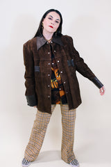 Women's or men's vintage 1970's Montgomery Ward label long sleeve brown suede jacket with popper buttons and dark brown leather trim.