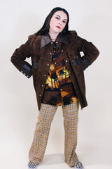 Women's or men's vintage 1970's Montgomery Ward label long sleeve brown suede jacket with popper buttons and dark brown leather trim.