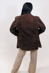 Women's or men's vintage 1970's Montgomery Ward label long sleeve brown suede jacket with popper buttons and dark brown leather trim.