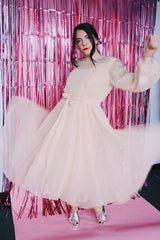 long sleeve midi length tan colored party dress with sheer arms and beads on shoulders vintage 1980's