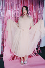 long sleeve midi length tan colored party dress with sheer arms and beads on shoulders vintage 1980's