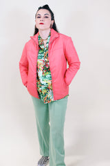 Women's vintage 1970's White Stag USA long sleeve pink colored nylon zip up lightweight windbreaker jacket with two pockets.