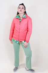 Women's vintage 1970's White Stag USA long sleeve pink colored nylon zip up lightweight windbreaker jacket with two pockets.