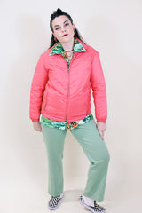 Women's vintage 1970's White Stag USA long sleeve pink colored nylon zip up lightweight windbreaker jacket with two pockets.