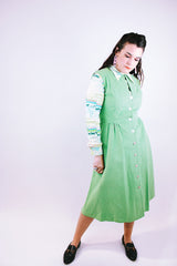 sleeveless midi length pastel green suede dress buttons up the front