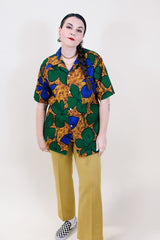 Women's or men's vintage 1970's Towncraft for JCPenney label short sleeve button up Hawaiian print shirt in brown, green, and blue Hawaiian print.
