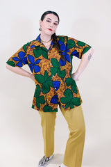 Women's or men's vintage 1970's Towncraft for JCPenney label short sleeve button up Hawaiian print shirt in brown, green, and blue Hawaiian print.
