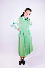 sleeveless midi length pastel green suede dress buttons up the front