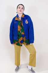 Women's or men's vintage 1960's (67'-68') Fab-Knit Quality Supreme label long sleeve navy blue corduroy zip up FFA jacket with patches and text embroidery throughout.