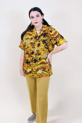 Women's or men's vintage 1970's short sleeve button up Hawaiian print shirt in yellow and brown colors.