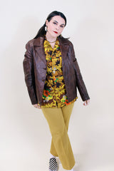 Women's vintage 1970's Adler Leather MFG. CO., Made in California label short length long sleeve brown leather button up jacket with double lapel.