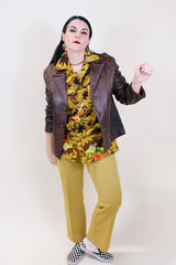 Women's vintage 1970's Adler Leather MFG. CO., Made in California label short length long sleeve brown leather button up jacket with double lapel.