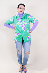 Women's or men's vintage 1990's Hilo Hattie's Hawaii short sleeve button up shirt in all over Hawaiian print.