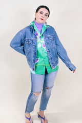 Women's or men's vintage 1990's medium wash blue button up Levi's denim jacket with collar.