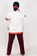 Women's vintage 1960's Kandel All National label long sleeve button up wool cream colored cardigan with two front pockets and various maroon colored patches.