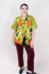 Women's or men's vintage 1970's Sears Hawaii label short sleeve Cotton material all over green Hawaiian print button up shirt with one chest pocket and double lapel.