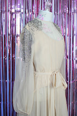 long sleeve midi length tan colored party dress with sheer arms and beads on shoulders vintage 1980's