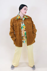 Men's vintage 1970's Pacific Trail Sportswear label long sleeve light brown colored PVC suede button up jacket with dagger collar.