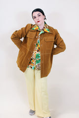 Men's vintage 1970's Pacific Trail Sportswear label long sleeve light brown colored PVC suede button up jacket with dagger collar.