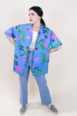 Women's or men's vintage 1990's Hilo Hattie, Made in Hawaii short sleeve button up shirt in all over blue Hawaiian floral print.