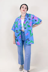 Women's or men's vintage 1990's Hilo Hattie, Made in Hawaii short sleeve button up shirt in all over blue Hawaiian floral print.