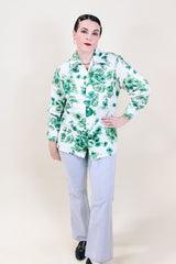 Women's or men's vintage 1970's Triumph of California label long sleeve button up shirt with dagger collar. White polyester with all over green floral print.