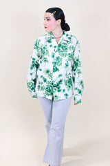 Women's or men's vintage 1970's Triumph of California label long sleeve button up shirt with dagger collar. White polyester with all over green floral print.
