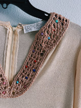 Women's vintage 1970's Keith Adams For Tannel label long sleeve midi length cream tan colored tunic dress with embroidered neckline with bead and a tassel beaded belt.