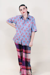 Women's or men's vintage 1970's JCPenney label short sleeve button up shirt with dagger collar in a lightweight polyester blue paisley print material.