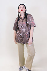 Women's or men's vintage 1970's Triumph of California label short sleeve button up shirt with pointy collar in polyester material.